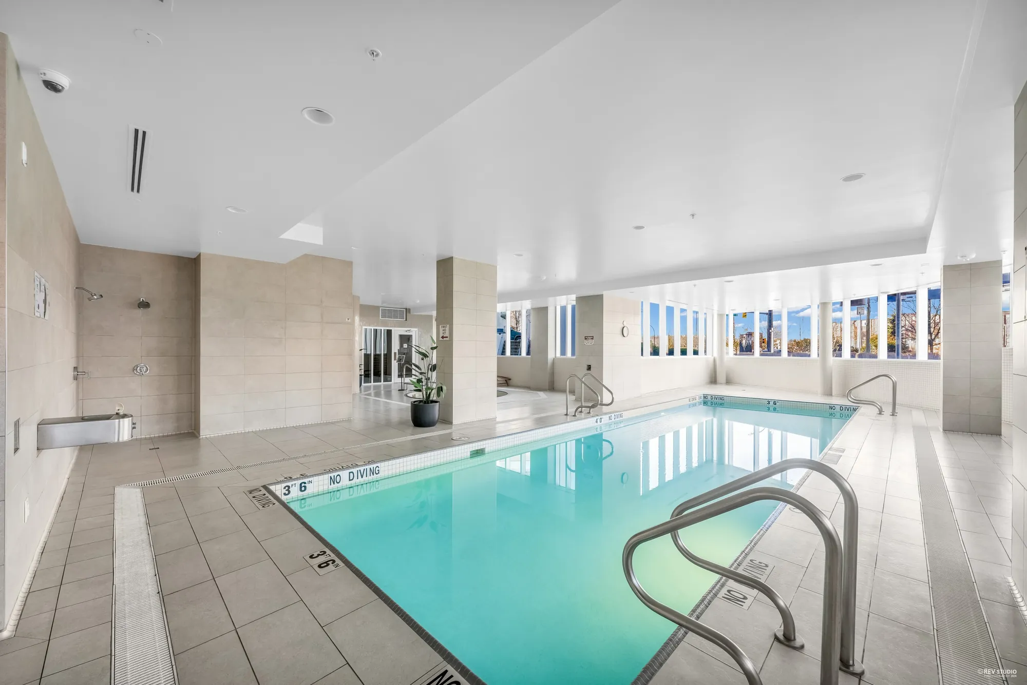 The indoor pool with windows along one side