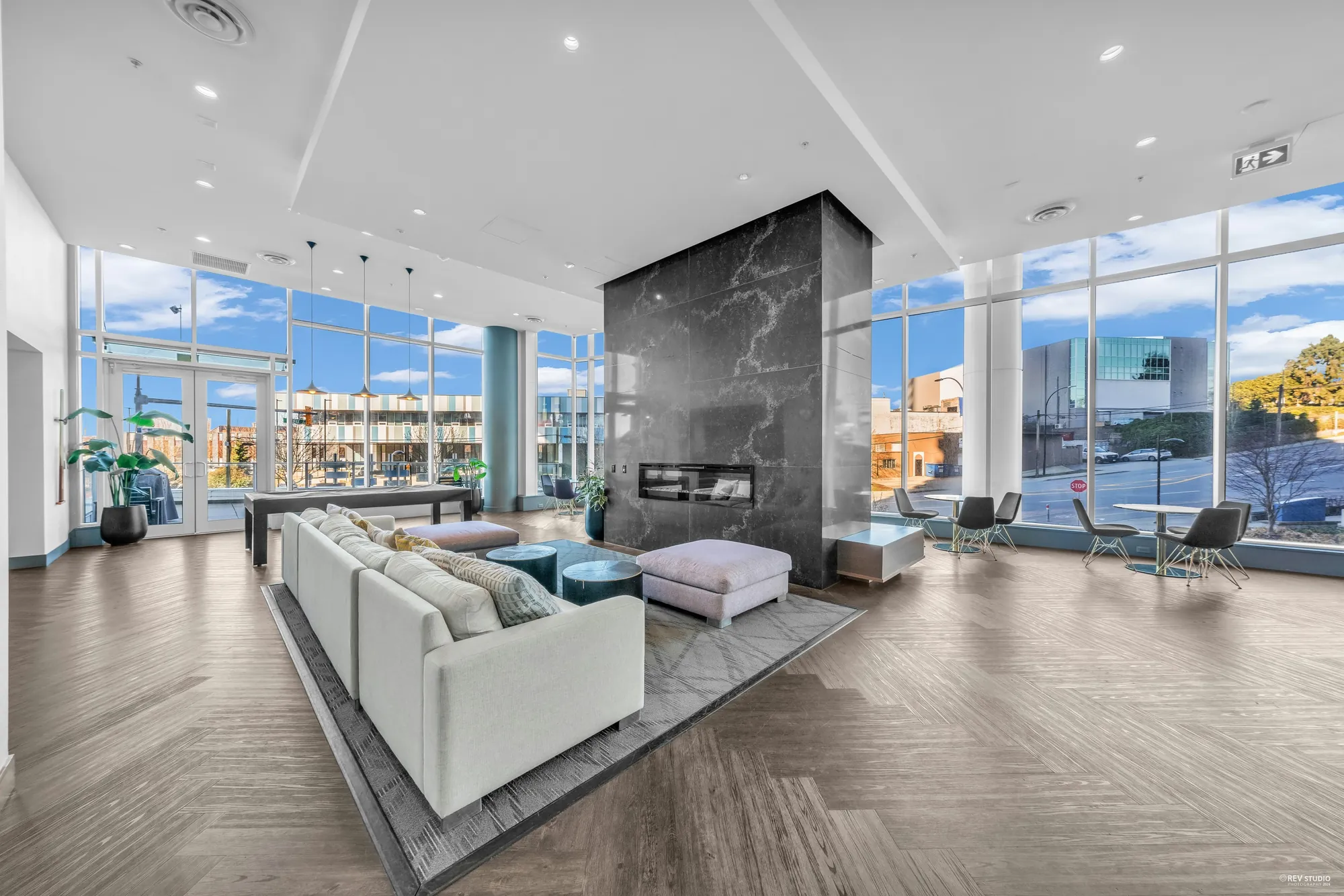 The residents lounge with sofas and a stone fireplace