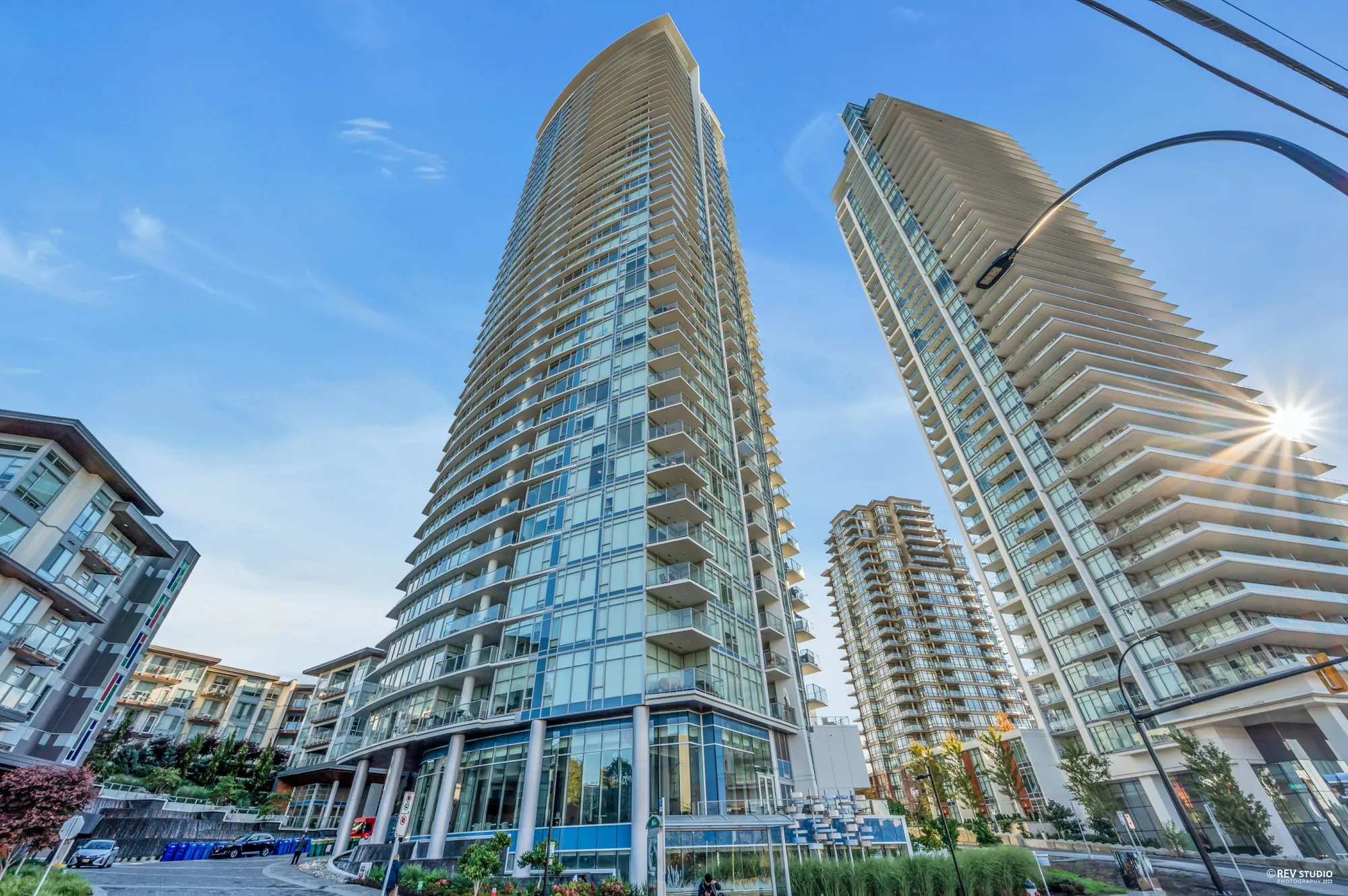 Escala from the street, two glass towers rising above the podium