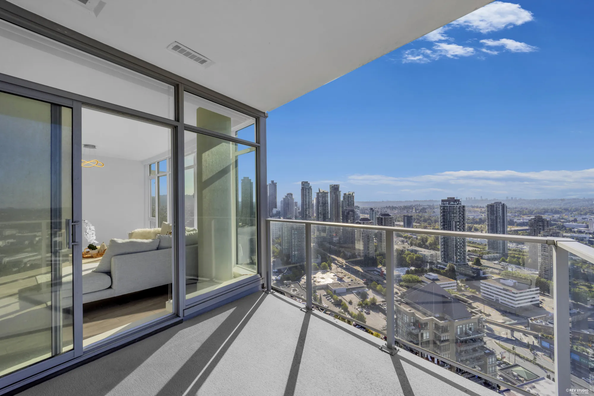 Looking back along the balcony to the living room through the sliding doors