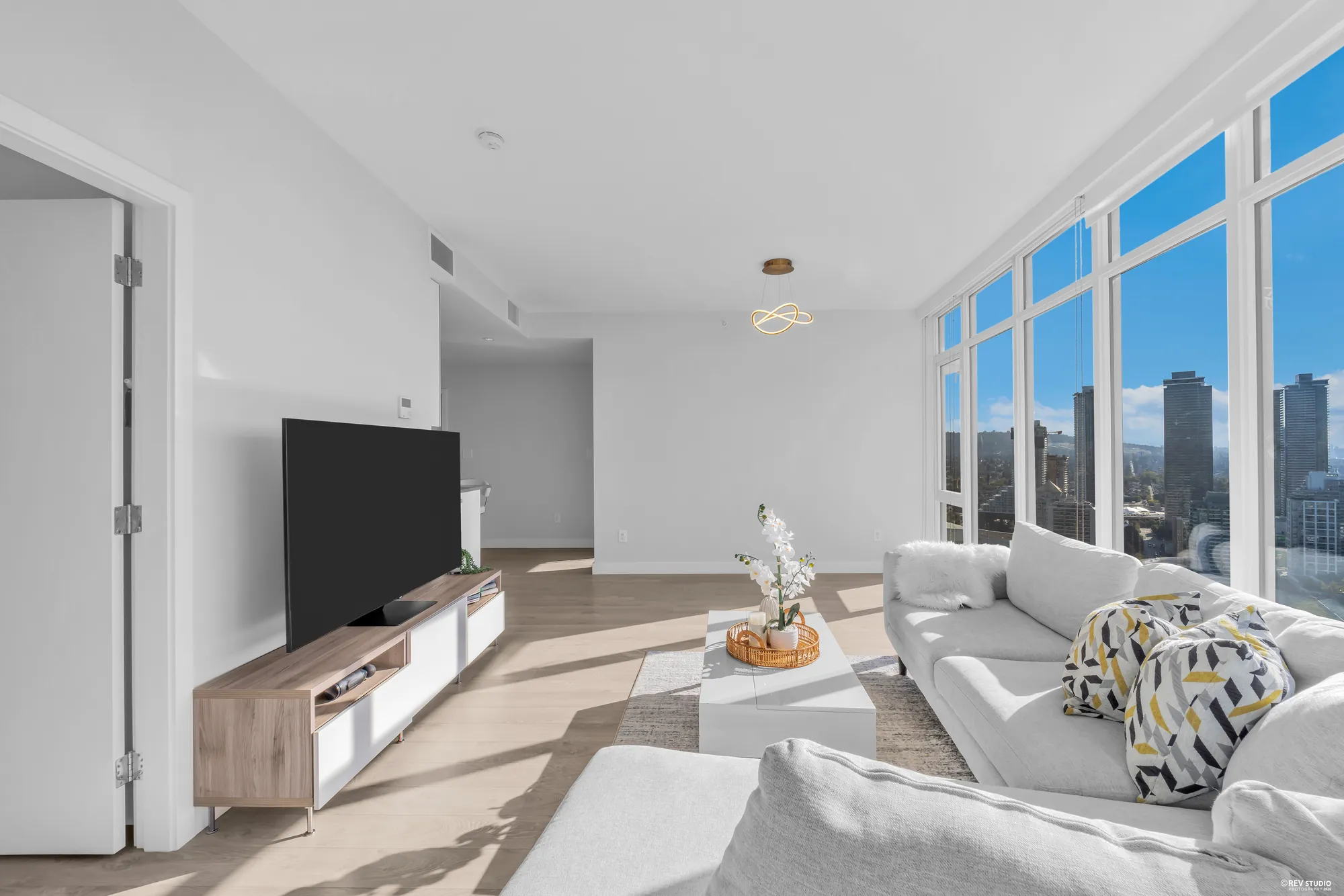 The living room from the entry, with the bedroom door open on the left
