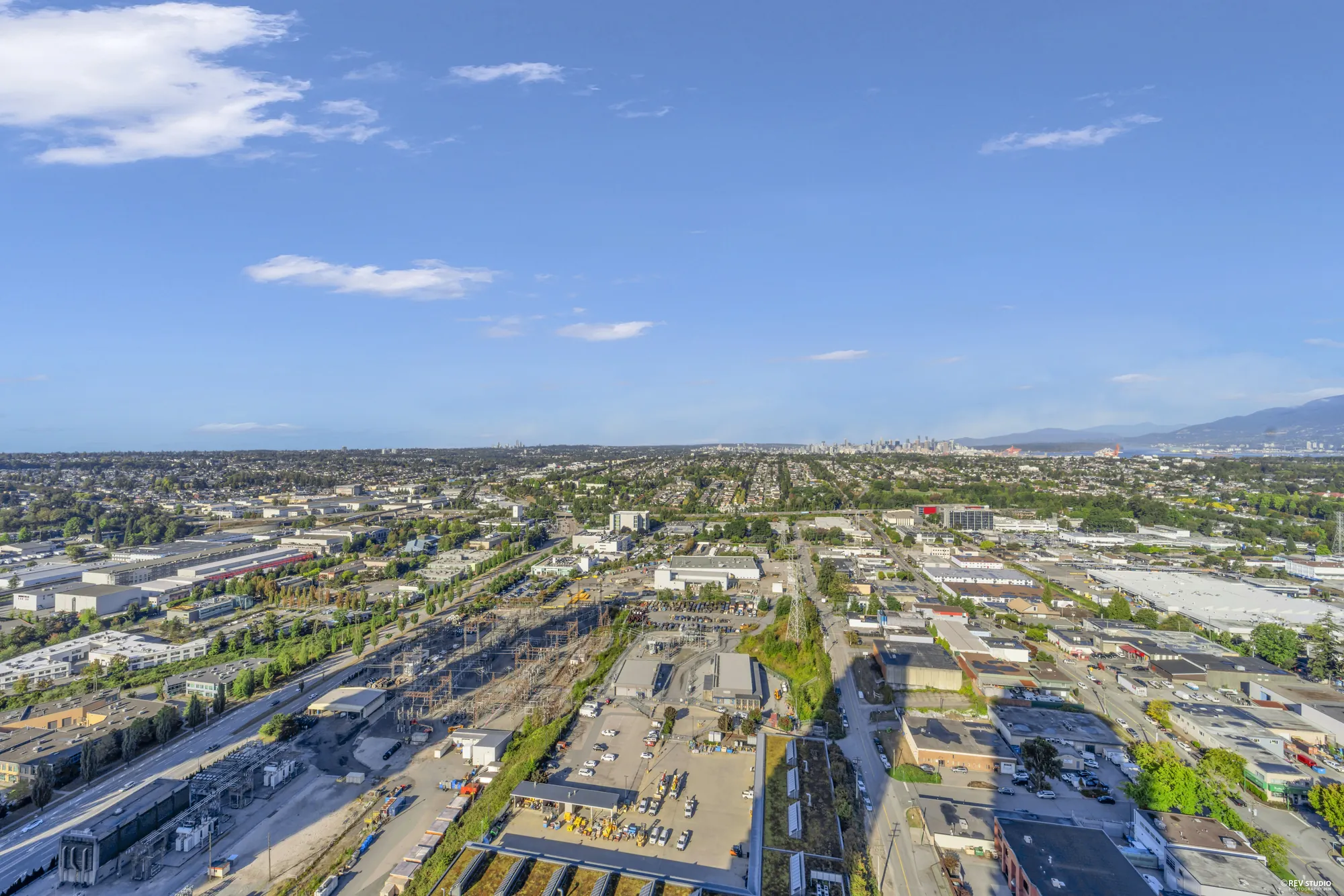 The view east over the rail yards and the low roofs of Burnaby