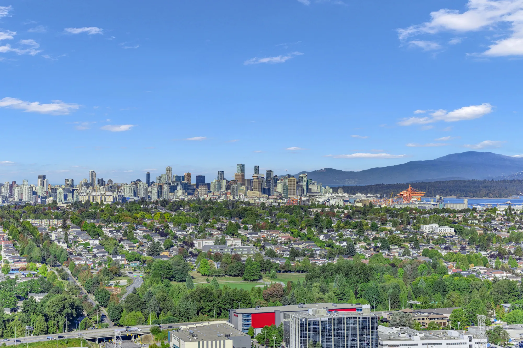 The view southwest across Burnaby with the downtown skyline on the horizon